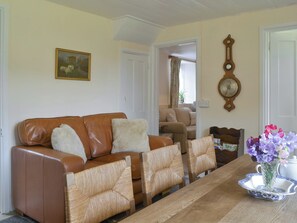 Comfortable seating area within the dining room | Winscott Cottage, Holsworthy, near Bude