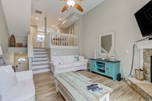 Walk up the stairs to the kitchen and dining area.