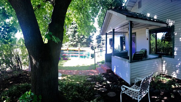 nice private shady front yard and porch.  almost always cool place to sit 