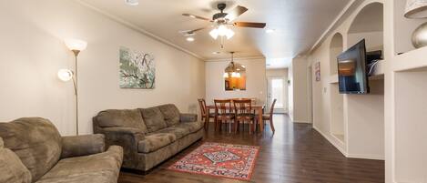 Front door, living room, and dining room space.