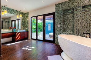 Master suite bathroom with indoor and outdoor showers in Main House