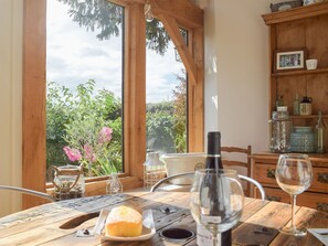 Rustic dining table with garden view | The Garden Retreat, Marbury, near Whitchurch