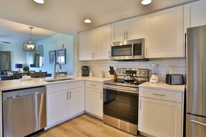 Updated Fully Equipped Kitchen with Stainless Appliances Granite Counter Tops