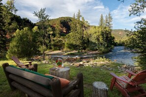Steps from the Roaring Fork River, the cabin is the perfect Colorado retreat.