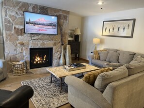 Beautiful gas fireplace with big screen tv