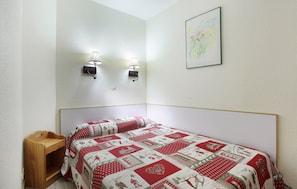 The master bedroom features a cozy Double bed.