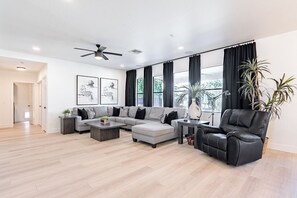 Living Room with Large Sectional, Recliner, and Sound System