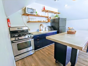 Fully stocked kitchen with full size appliances