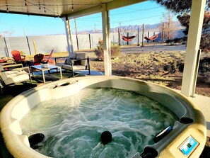 Relaxing in the hot tub under the covered patio is the best after a long hike. 