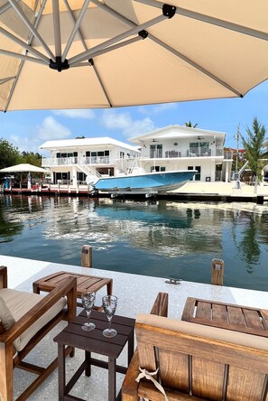 Sun or Shade! Kick back, relax & Enjoy the water, a cocktail, drink or wine! 