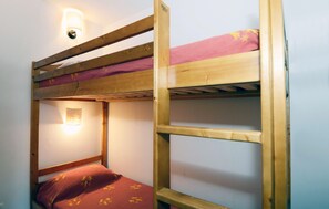 Tuck the kids into the bunk beds in the sleeping alcove.