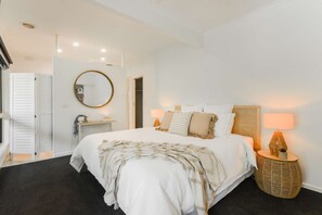 Master bedroom with King Bed, spilt system cooling and heating, ceiling fan, smart TV, walk in wardrobe and ensuite bathroom