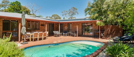 The Pool House offers a sun filled pool area with solar heating and sun lounges