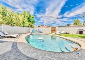 Enjoy sunning & funning in our heated pool. Fun backyard with grill & games!