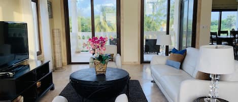 Living room with tropical and ocean view