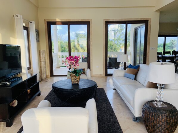 Living room with tropical and ocean view