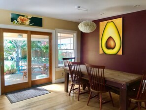 Dine in natural light at a farm table, slider to overbuilt deck, hot-tub, yard.