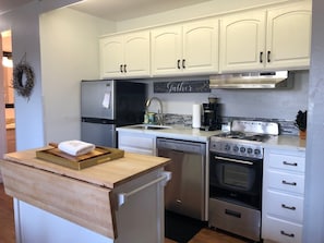 New kitchen with quartz counters and stainless steel appliances