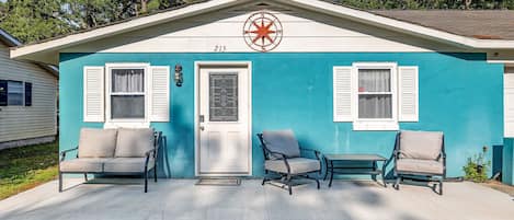 Front of home with patio area and comfortable seating