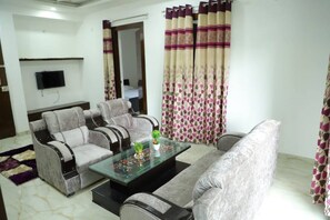 Beautifully Decorated Living room with proper sitting arrangement. 