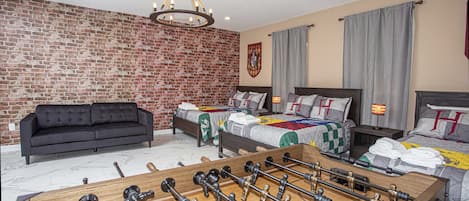 Harry Potter-Themed Game Room
Create magical memories with foosball and three full-sized beds for extra fun!