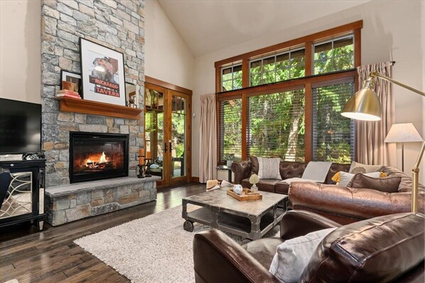 Living Room with 22 ft ceiling and gas fireplace