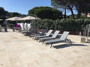 Large sunbathing terrace with sea views & heated swimming pool.
