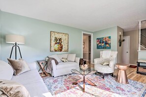 There's plenty of space for everyone to spread out and relax in the living room.