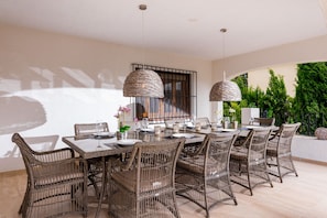 Outside dining area  50 m2 with covered terresse and scenic view on first floor.