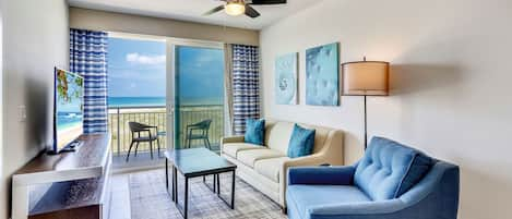 Beach front living room with a large balcony