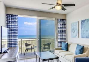 Large sliding doors opening up to beach front balcony