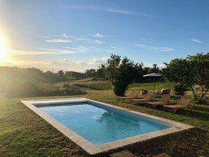 The heated pool is the perfect spot to cool off and enjoy the vineyard views.