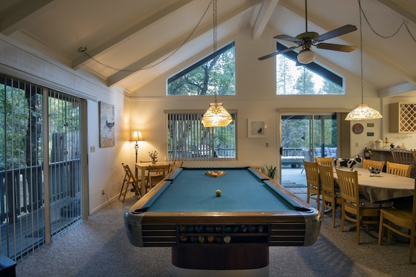 Pool table in the family room, and game table for four.