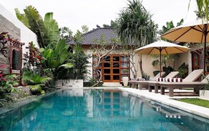 Dayak-Asmat Pool with tropical garden around.