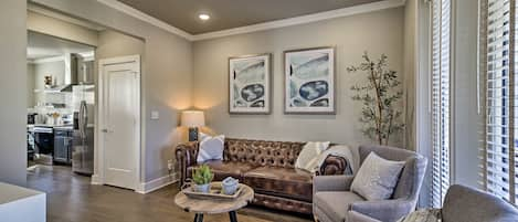 Stylish and comfortable living room with kitchen.