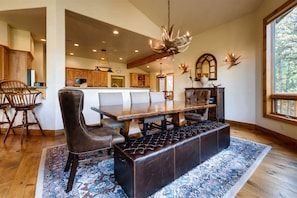 Dining room w/ seating for 9 adjacent to kitchen with seating for 6.