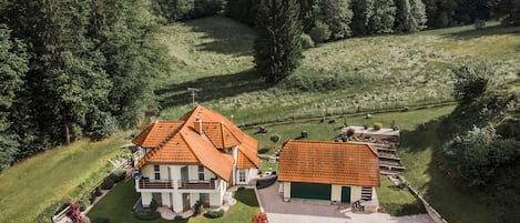 Villa at the end of the village surrounded by meadows and forests.