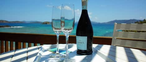 Enjoy your vacation with cold bubbly overlooking the vast of blue!