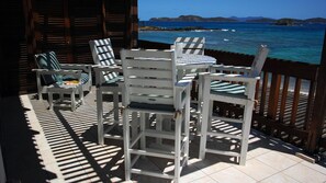 Our balcony has a lounge, club chair and offers a high dining table for 4