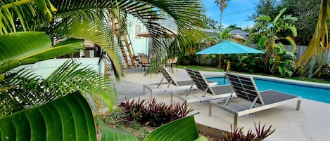 Rest and relaxation in your own eden of Cocoa Beach! Heated pool, rooftop deck!