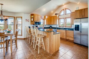 Prepare meals in the well-equipped kitchen with upscale appliances and plenty of space.