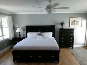 King bedroom with French doors out to the stone patio.