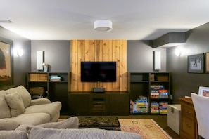 Living TV area with deep couches, HDTV w/ Bell Satellite & Netflix connectivity