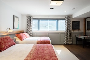 2 Medium firm Queen beds with soft pillows, plush duvets and black out blinds.