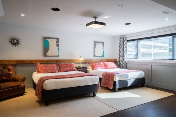 2 Medium firm Queen beds with soft pillows, plush duvets and black out blinds.