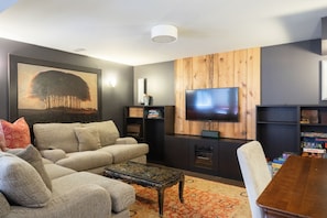 Living TV area with deep couches, HDTV w/ Bell Satellite & Netflix connectivity