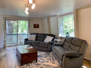 Cozy living room with reclining couch and love seat