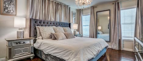 beautiful large master with luxury linens. 