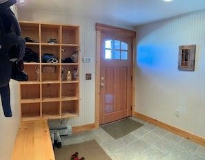 First floor entrance foyer with ski storage.