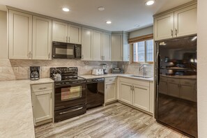 The updated kitchen has all amenities one could want. 